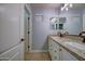 Elegant bathroom with dual sinks, granite countertop, and updated light fixtures at 23116 N 41St St, Phoenix, AZ 85050