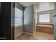 Bathroom with soaking tub, tile flooring, and window with blinds at 23116 N 41St St, Phoenix, AZ 85050