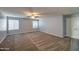Bright bedroom featuring carpet, ceiling fan and neutral walls at 23116 N 41St St, Phoenix, AZ 85050