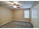 Spacious bedroom with ceiling fan and sliding door closet at 23116 N 41St St, Phoenix, AZ 85050