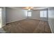 Bright bedroom with carpet, ceiling fan and window blinds at 23116 N 41St St, Phoenix, AZ 85050
