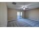 Spacious bedroom with private balcony access and ceiling fan at 23116 N 41St St, Phoenix, AZ 85050