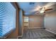 Bright bedroom featuring a window, closet, and ceiling fan at 23116 N 41St St, Phoenix, AZ 85050