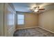 Comfortable bedroom with ceiling fan and double door closet at 23116 N 41St St, Phoenix, AZ 85050