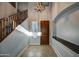 Bright entryway with tiled floors and wooden staircase at 23116 N 41St St, Phoenix, AZ 85050