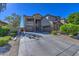 Two-story house with a three-car garage and driveway at 23116 N 41St St, Phoenix, AZ 85050