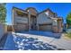 Two-story house with three-car garage and stone accents at 23116 N 41St St, Phoenix, AZ 85050