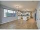 Open kitchen with white cabinets, island and stainless steel appliances at 23116 N 41St St, Phoenix, AZ 85050
