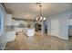 Open kitchen features a large island, white cabinets and stainless steel appliances at 23116 N 41St St, Phoenix, AZ 85050