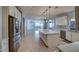 Open concept kitchen with island, stainless steel appliances and white cabinets at 23116 N 41St St, Phoenix, AZ 85050