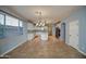 Open kitchen with island, white cabinets and stainless steel appliances at 23116 N 41St St, Phoenix, AZ 85050