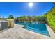 Inviting swimming pool with waterfall feature and large patio at 23116 N 41St St, Phoenix, AZ 85050