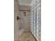 Walk-in shower with glass block wall and built-in seat at 23116 N 41St St, Phoenix, AZ 85050