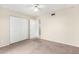 Bedroom with double-door closet and carpet at 2400 N 71St St # T, Scottsdale, AZ 85257