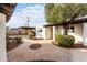 Building exterior with walkway, parking area, and landscaping at 2400 N 71St St # T, Scottsdale, AZ 85257