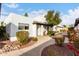 Spanish style building, walkway, and manicured shrubbery at 2400 N 71St St # T, Scottsdale, AZ 85257