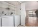 Laundry room with washer, dryer, and shelving at 2400 N 71St St # T, Scottsdale, AZ 85257