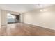 Living room with wood-look floors and sliding glass door to patio at 2400 N 71St St # T, Scottsdale, AZ 85257