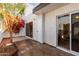 Private patio with flowering plants and a tree at 2400 N 71St St # T, Scottsdale, AZ 85257