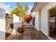 Private patio with wooden gate and landscaping at 2400 N 71St St # T, Scottsdale, AZ 85257