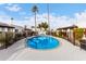 Refreshing community pool with surrounding patio furniture at 2400 N 71St St # T, Scottsdale, AZ 85257