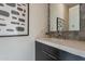 Modern bathroom with dark vanity and quartz countertop at 25580 N 119Th St, Scottsdale, AZ 85255