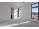 Well-lit bedroom with grey carpet and access to a bathroom at 25580 N 119Th St, Scottsdale, AZ 85255