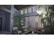 Inviting courtyard with sleek modern furniture, gas fire pit, and expansive sliding glass doors at 25580 N 119Th St, Scottsdale, AZ 85255