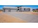 Contemporary home with large driveway and desert landscaping at 25580 N 119Th St, Scottsdale, AZ 85255