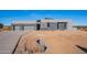 Modern home with stone accents and three-car garage at 25580 N 119Th St, Scottsdale, AZ 85255