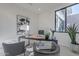 Modern home office with sleek desk and comfortable chairs at 25580 N 119Th St, Scottsdale, AZ 85255