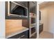 Built-in oven and microwave in a sleek, modern kitchen at 25580 N 119Th St, Scottsdale, AZ 85255
