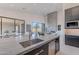 Stylish kitchen with large island, sink, and stainless steel appliances at 25580 N 119Th St, Scottsdale, AZ 85255