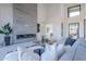Living room with modern fireplace and large windows at 25580 N 119Th St, Scottsdale, AZ 85255