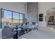 Spacious living area with a modern fireplace and sliding glass doors at 25580 N 119Th St, Scottsdale, AZ 85255