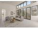 Bright living room with large windows and comfortable seating at 25580 N 119Th St, Scottsdale, AZ 85255