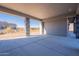 Covered patio with stone columns and views of the desert landscape at 25580 N 119Th St, Scottsdale, AZ 85255