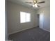 Spacious bedroom with neutral wall paint and ceiling fan at 26293 W Desert Crest St, Casa Grande, AZ 85193
