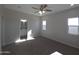 Bright bedroom with carpet flooring and an ensuite bathroom at 26293 W Desert Crest St, Casa Grande, AZ 85193