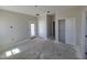 Spacious bedroom features walk out door and closet space with neutral paint and concrete floors at 26293 W Desert Crest St, Casa Grande, AZ 85193