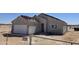 Exterior view of a home featuring a garage, neutral stucco, and under-construction roof at 26293 W Desert Crest St, Casa Grande, AZ 85193