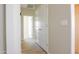 Hallway with light colored walls and wood-look flooring at 26293 W Desert Crest St, Casa Grande, AZ 85193