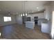 Open concept kitchen and living area with modern features at 26293 W Desert Crest St, Casa Grande, AZ 85193