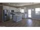 Modern kitchen with island, stainless steel appliances, and white cabinets at 26293 W Desert Crest St, Casa Grande, AZ 85193