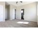 Main bedroom with carpet, ceiling fan, and ensuite bathroom at 26293 W Desert Crest St, Casa Grande, AZ 85193