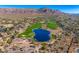 Stunning aerial of golf course with lake and mountain views at 3190 S Jacaranda Ct, Gold Canyon, AZ 85118