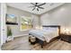 Spacious bedroom with large window, hardwood floors, and modern decor at 3190 S Jacaranda Ct, Gold Canyon, AZ 85118