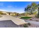 Landscaped community entrance with paved roads and mountain views at 3190 S Jacaranda Ct, Gold Canyon, AZ 85118