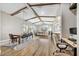 Open concept dining room with hardwood floors and wood beams at 3190 S Jacaranda Ct, Gold Canyon, AZ 85118