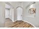 Bright entryway with arched doorways and wood-look flooring at 3190 S Jacaranda Ct, Gold Canyon, AZ 85118